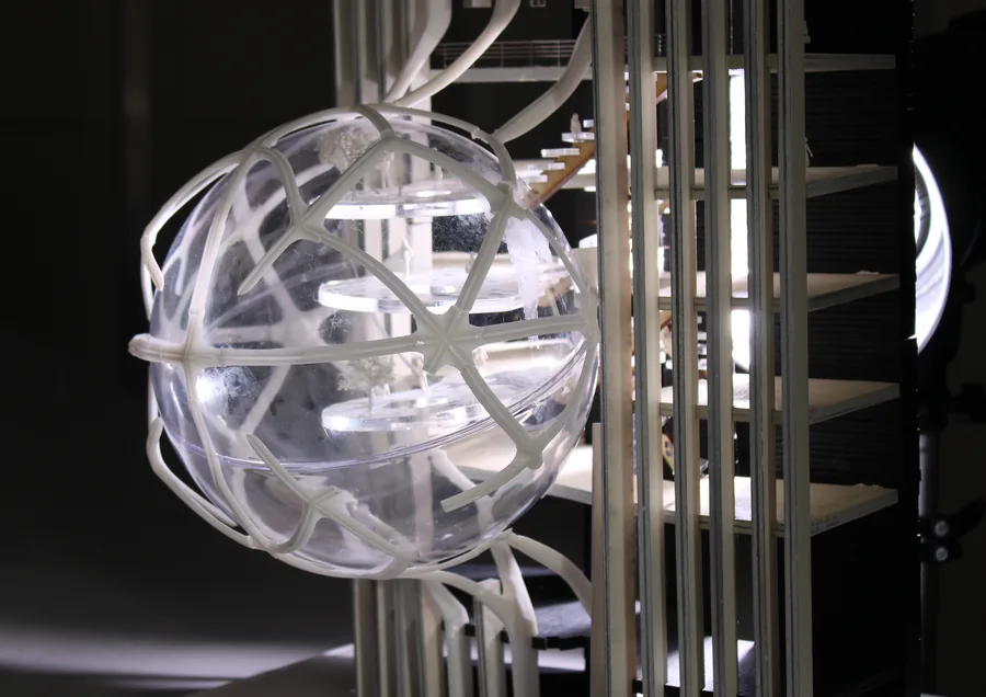 A physical prototype testing how one capsule is structurally attached to the existing building